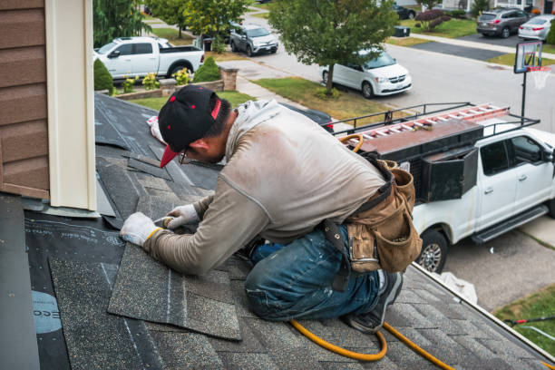Professional Roofing technician working in Mineola, NY
